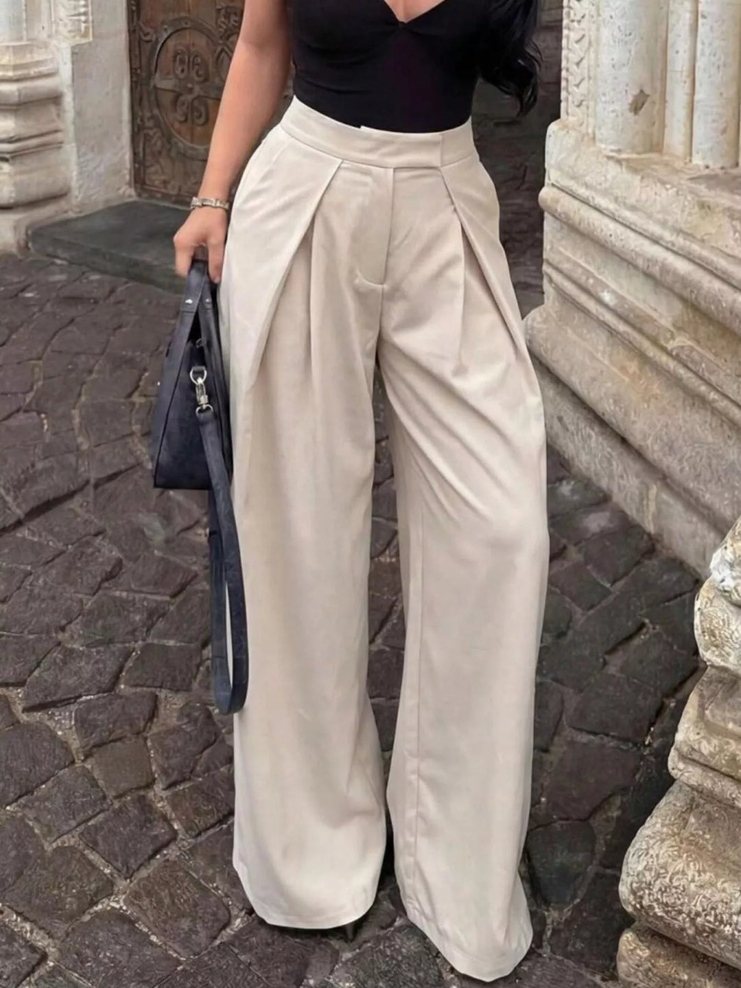 High-rise pleated wide leg pants with deep front pleats