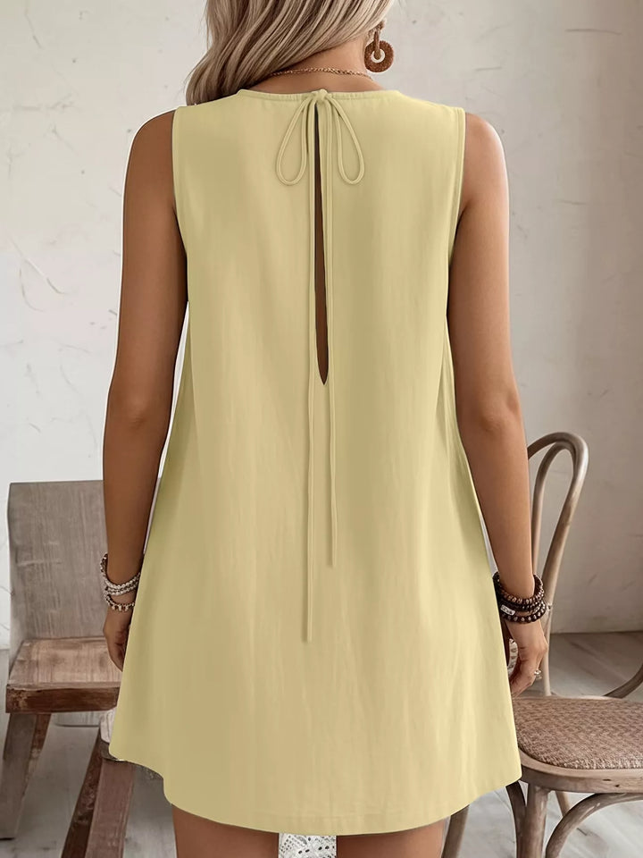 Ruffle-trim sleeveless mini dress with side pockets