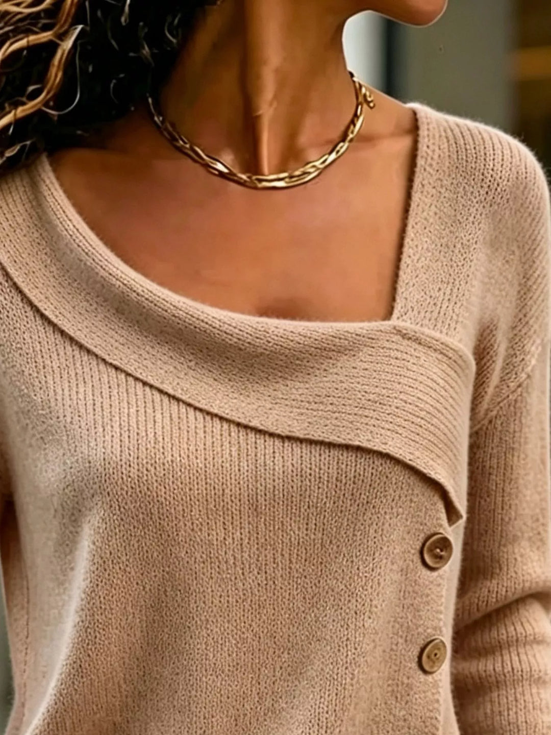 Asymmetrical button sweater with angled ribbed neckline