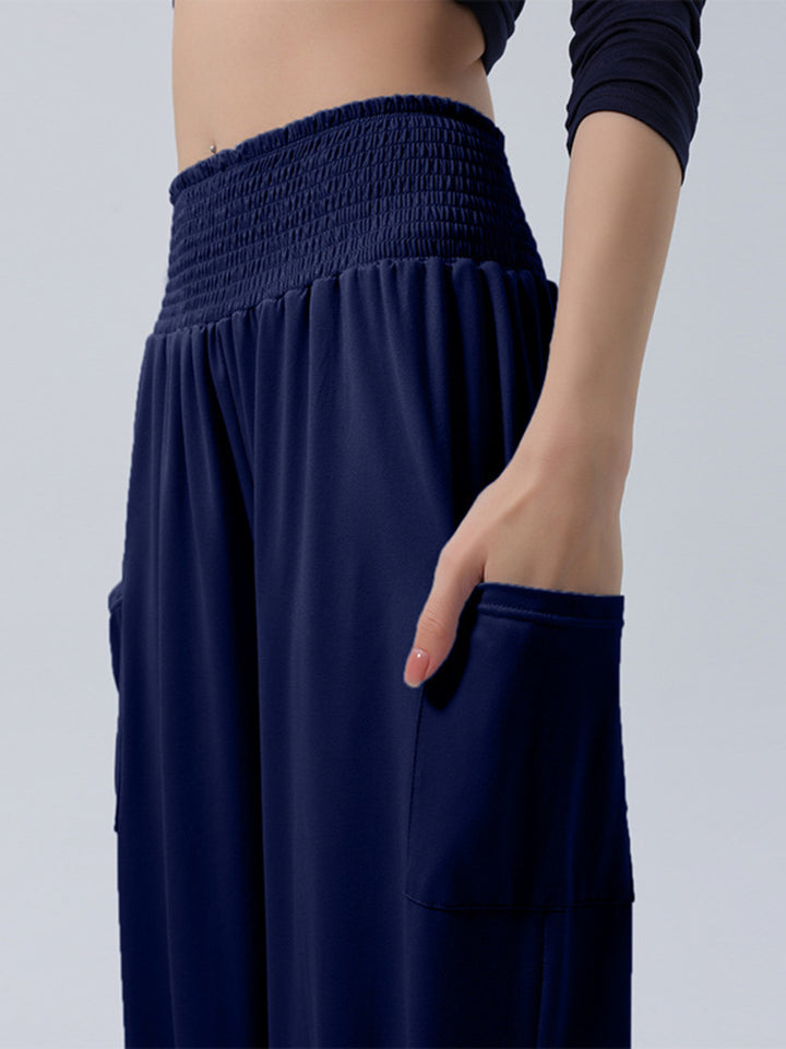 High-rise smocked harem pants with side pockets