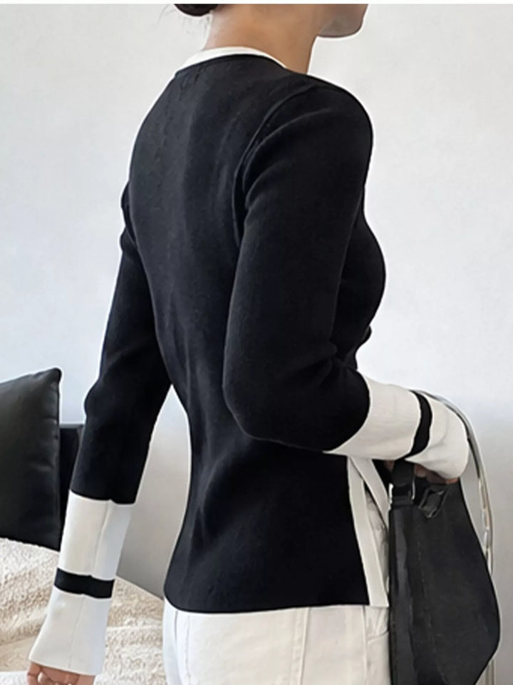 Ribbed knit side slit sweater with contrast trim