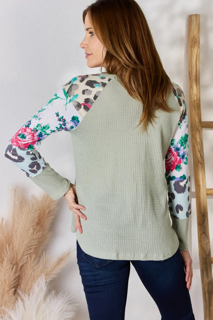Waffle knit top with floral and leopard print sleeves