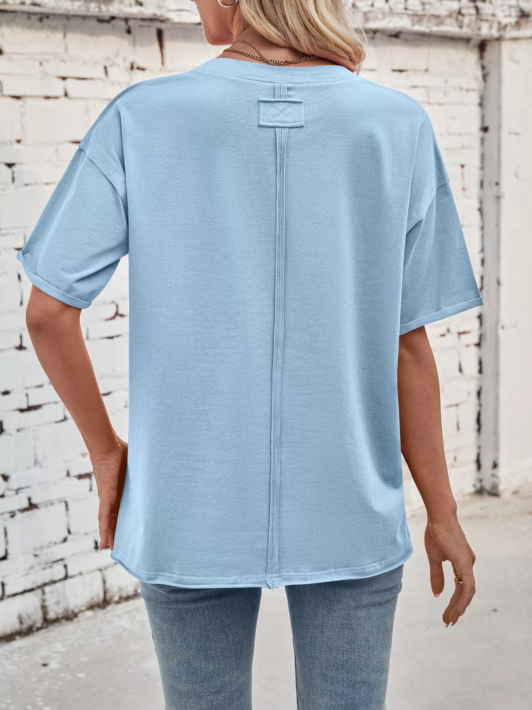 Drop-shoulder loose-fit crew neck tee with cuffed sleeves
