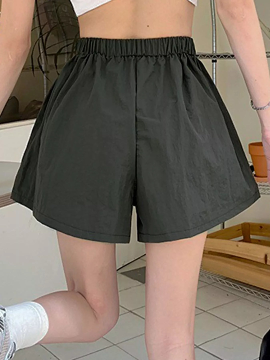 High-rise cargo shorts with zip pockets and drawstring waist