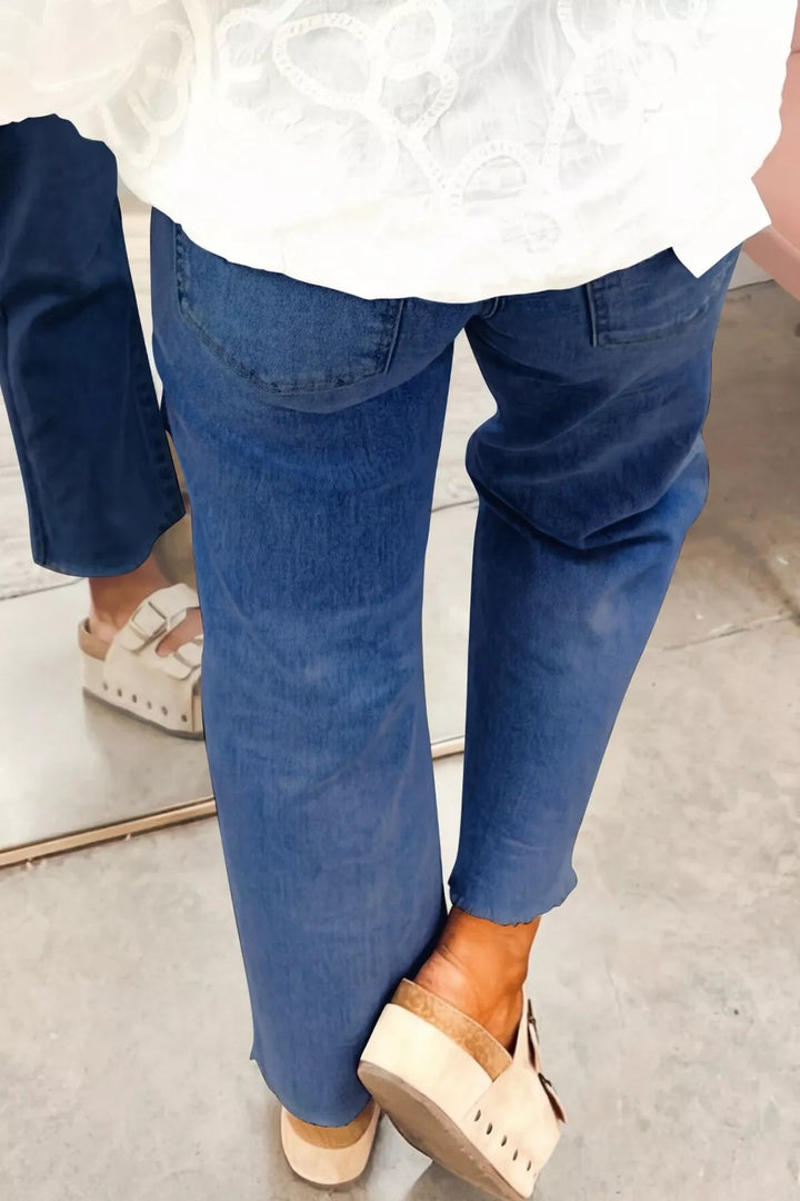 High-rise straight-leg jeans with patch pockets and raw hem