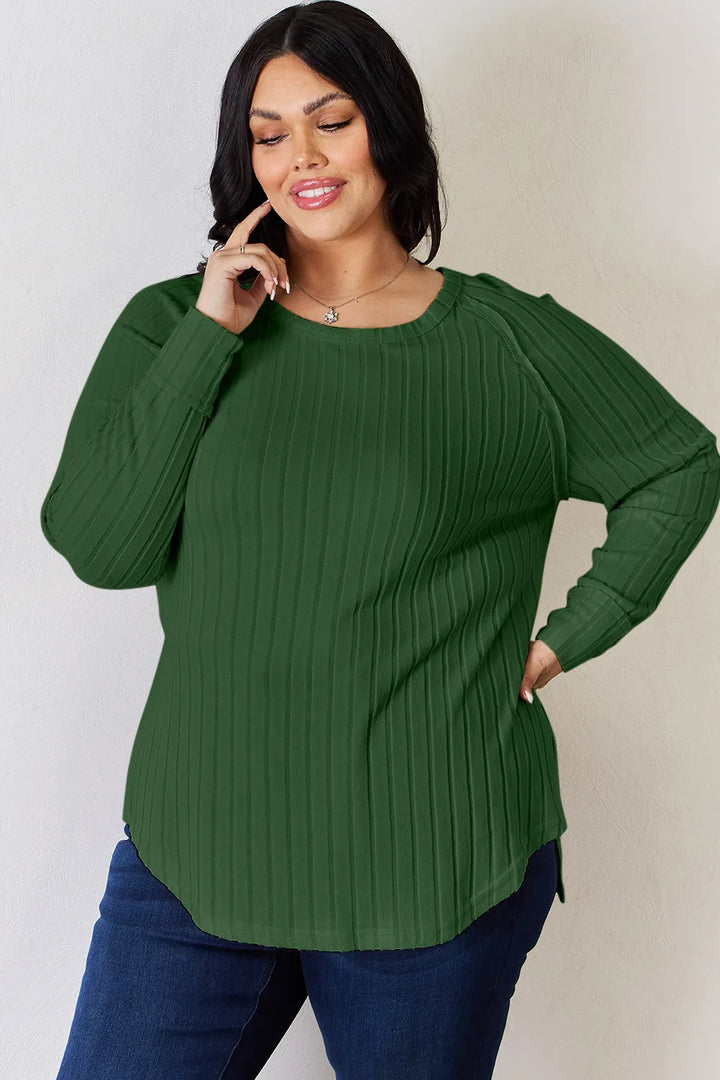 Ribbed knit round neck long sleeve top with side slits
