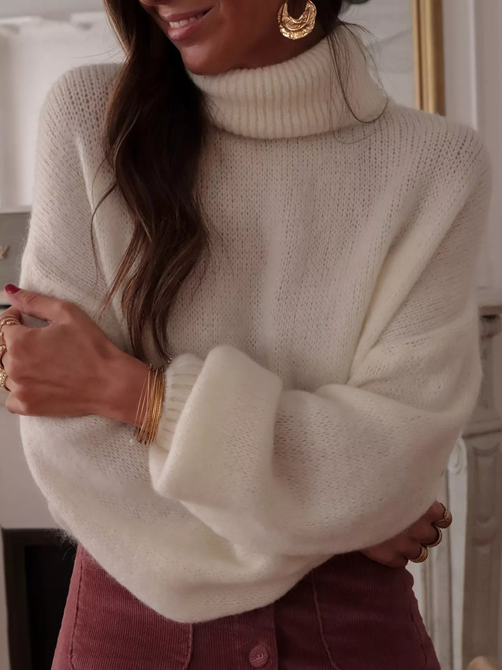 Oversized turtleneck sweater with dropped shoulders and ribbed cuffs