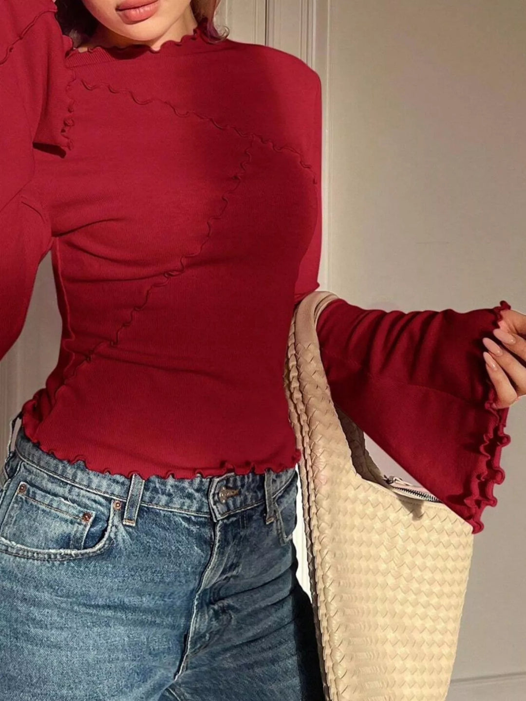 Ribbed knit mock neck top with lettuce-edge flare sleeves