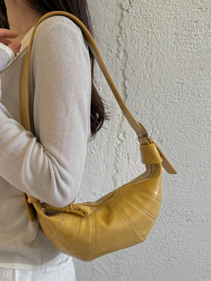 Croissant crossbody bag with adjustable strap and zip top