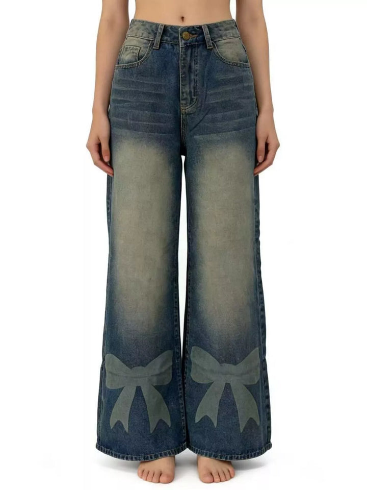 Bow-detail wide leg jeans with faded whiskering