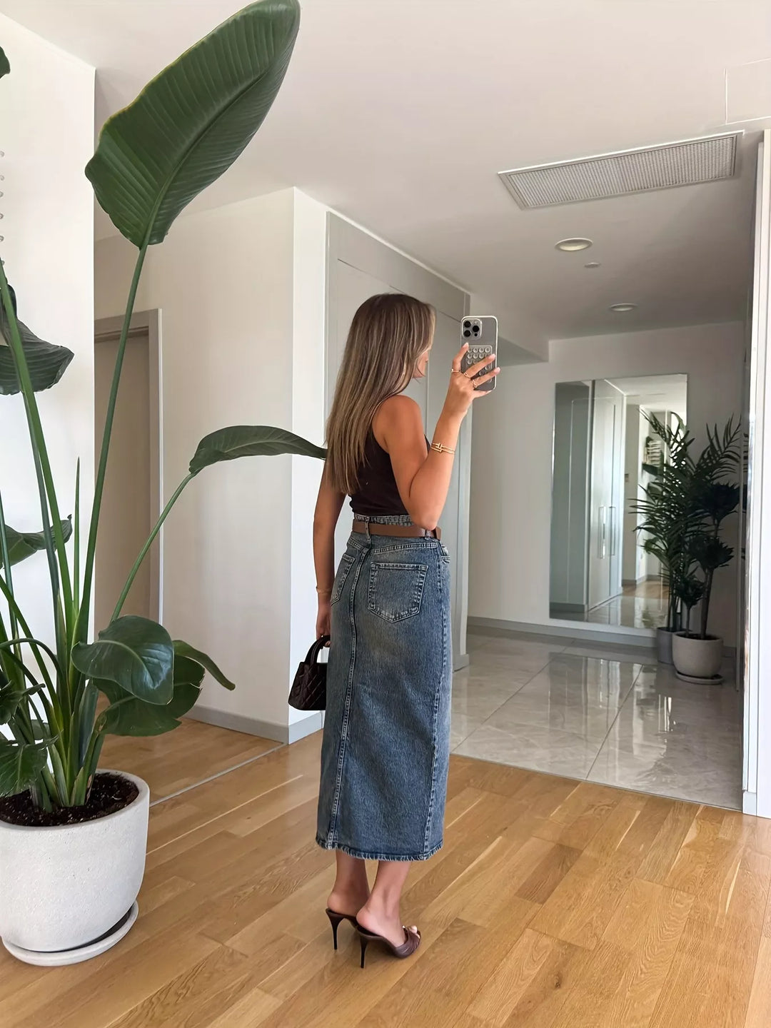 High-rise midi denim skirt with front slit