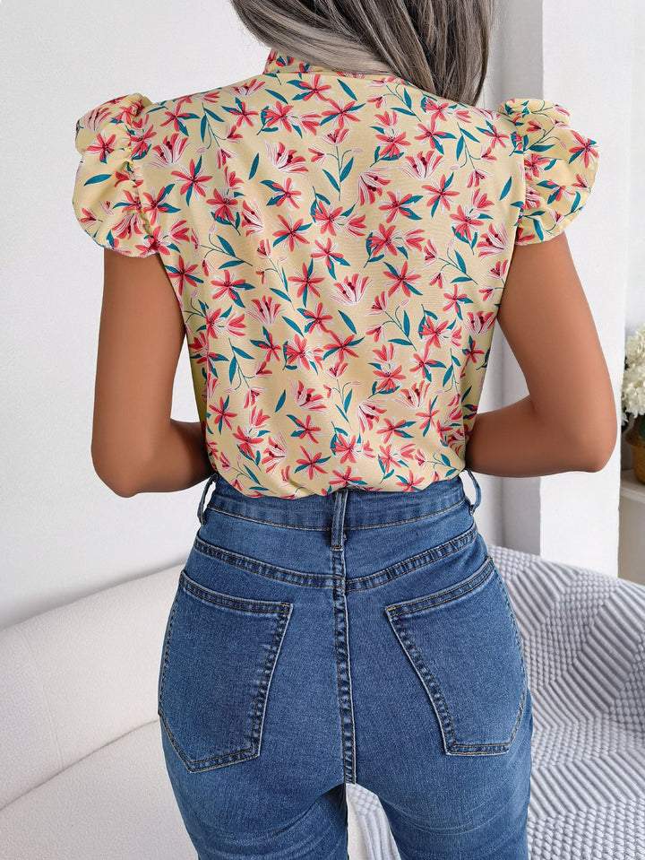 Floral tie-neck blouse with ruffled flutter sleeves