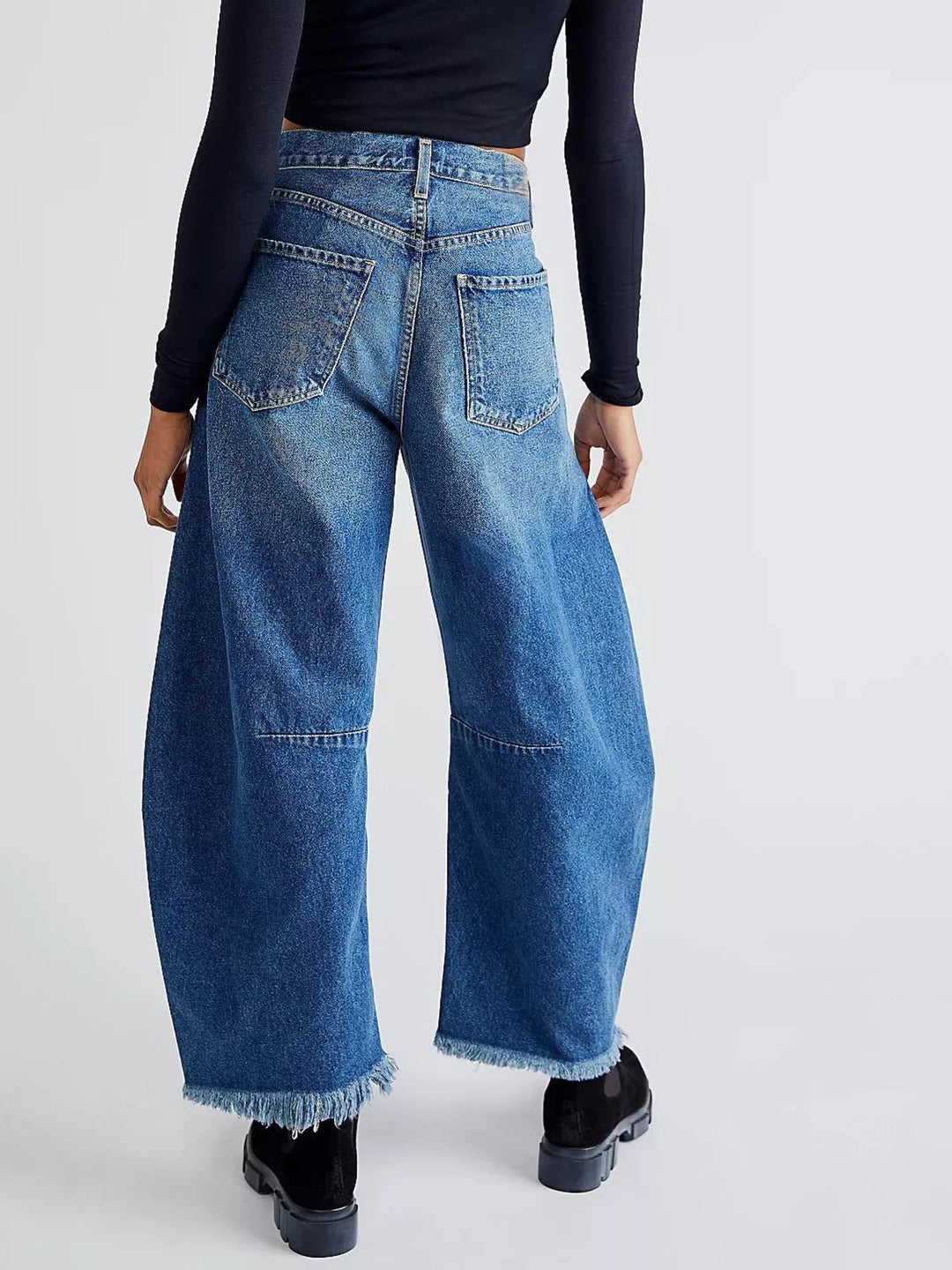 High-rise barrel-leg jeans with raw frayed hem