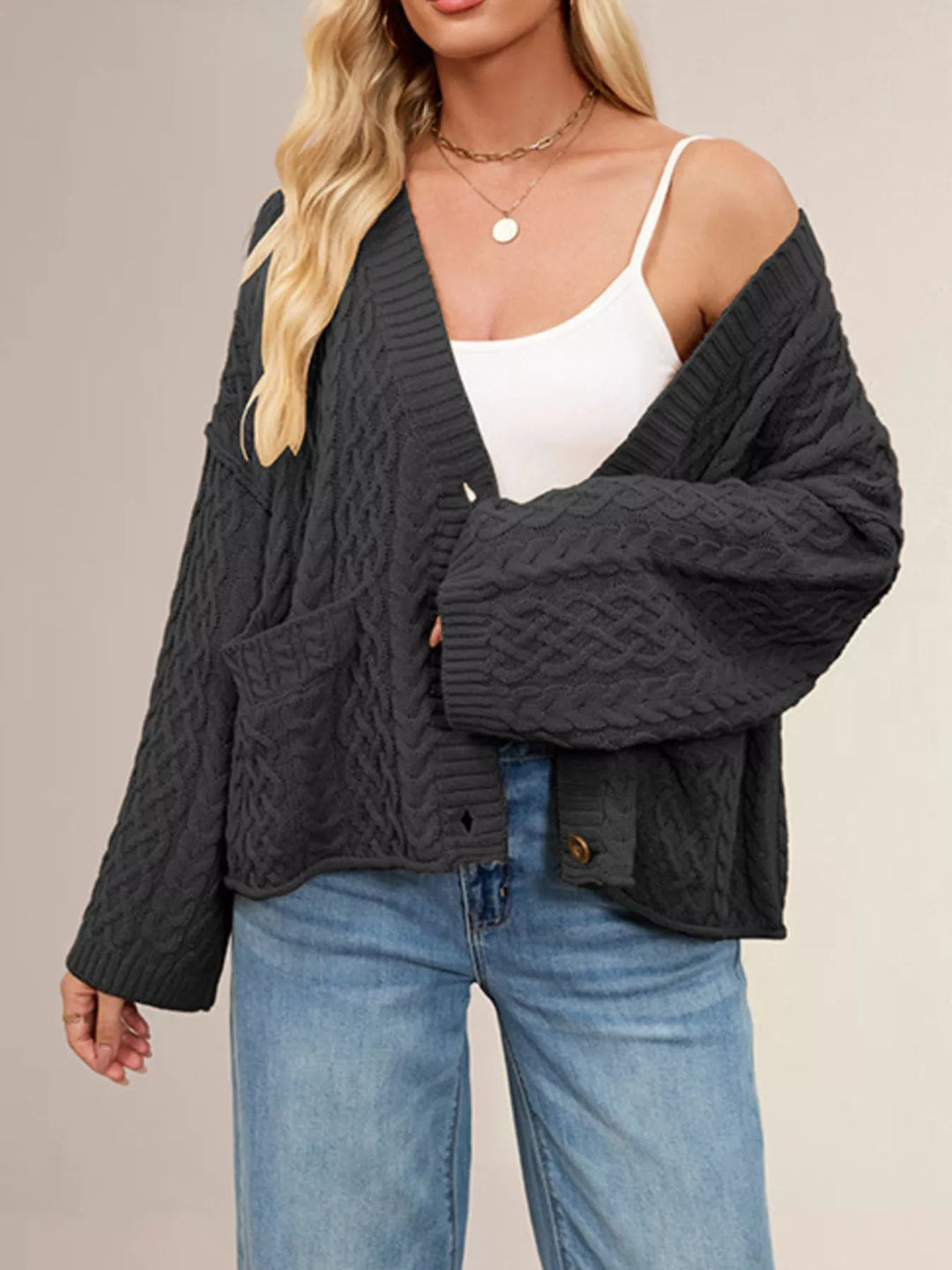 Cable knit button-front cardigan with patch pockets
