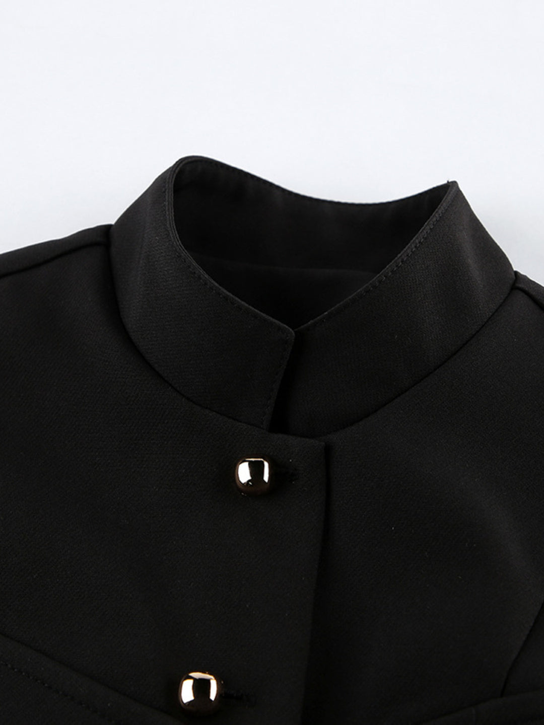 Stand collar sleeveless button-front vest with split hem