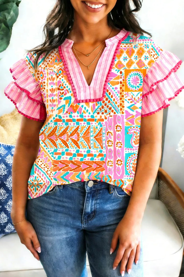Patchwork mixed print blouse with ruffle sleeves and pom-pom trim