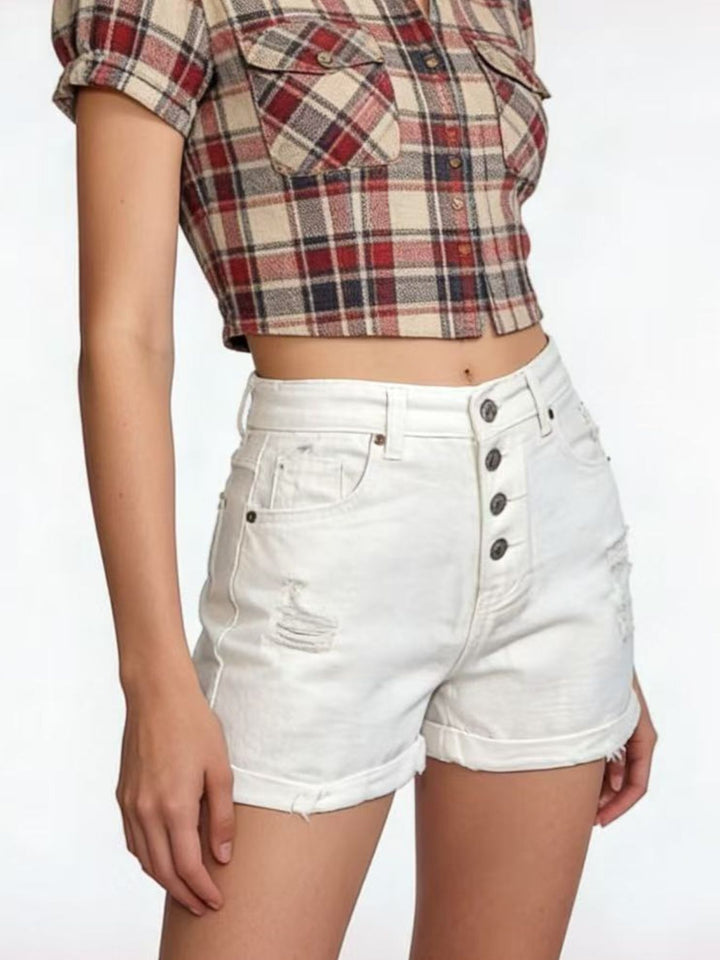 High-rise distressed denim shorts with button fly and rolled hem