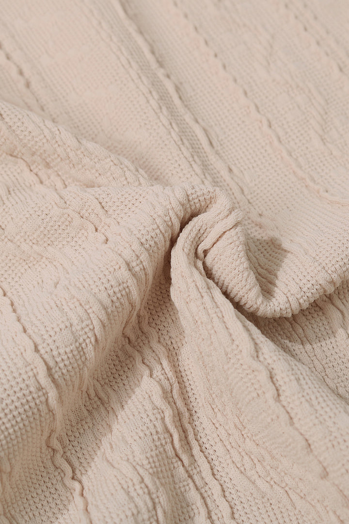 Textured knit long sleeve top with asymmetric button collar