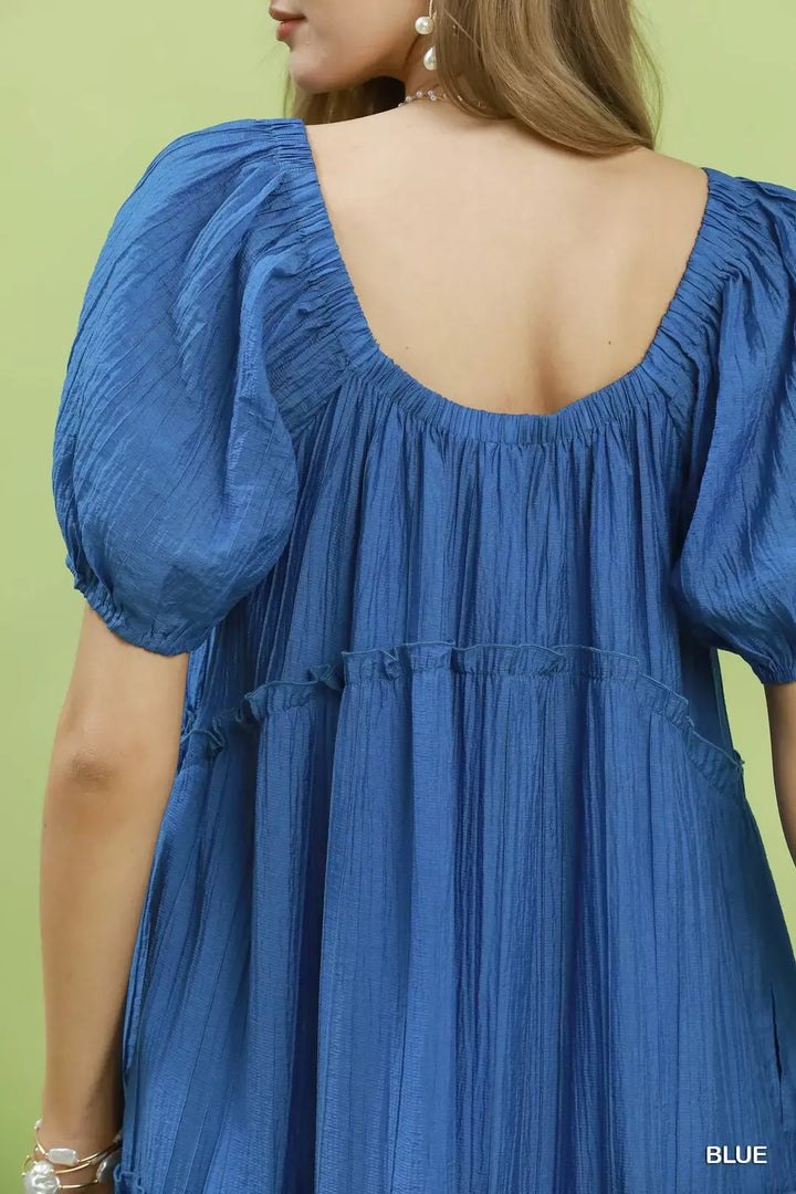 Textured tiered midi dress with puff sleeves and pockets
