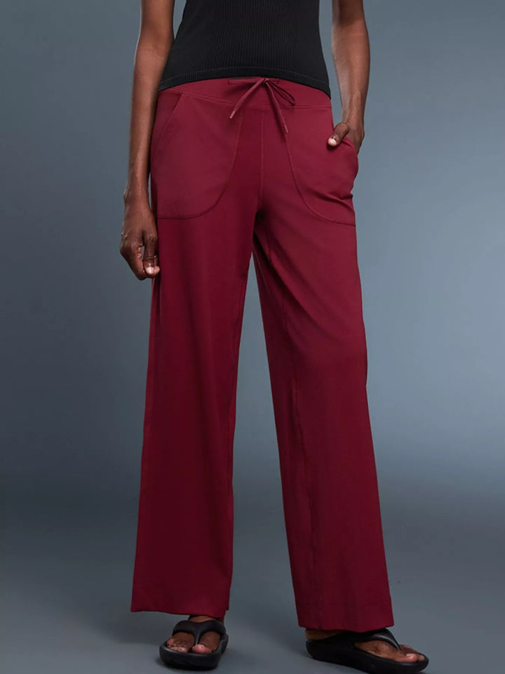 Wide-leg drawstring pants with curved front pockets