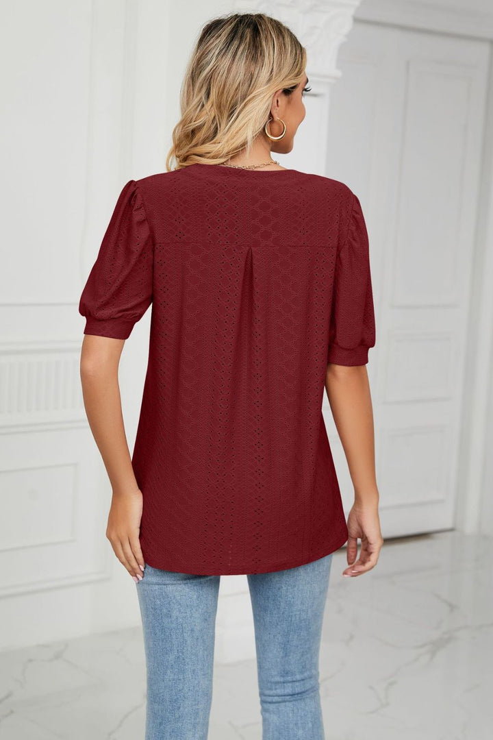 Eyelet puff sleeve top with notched V-neck