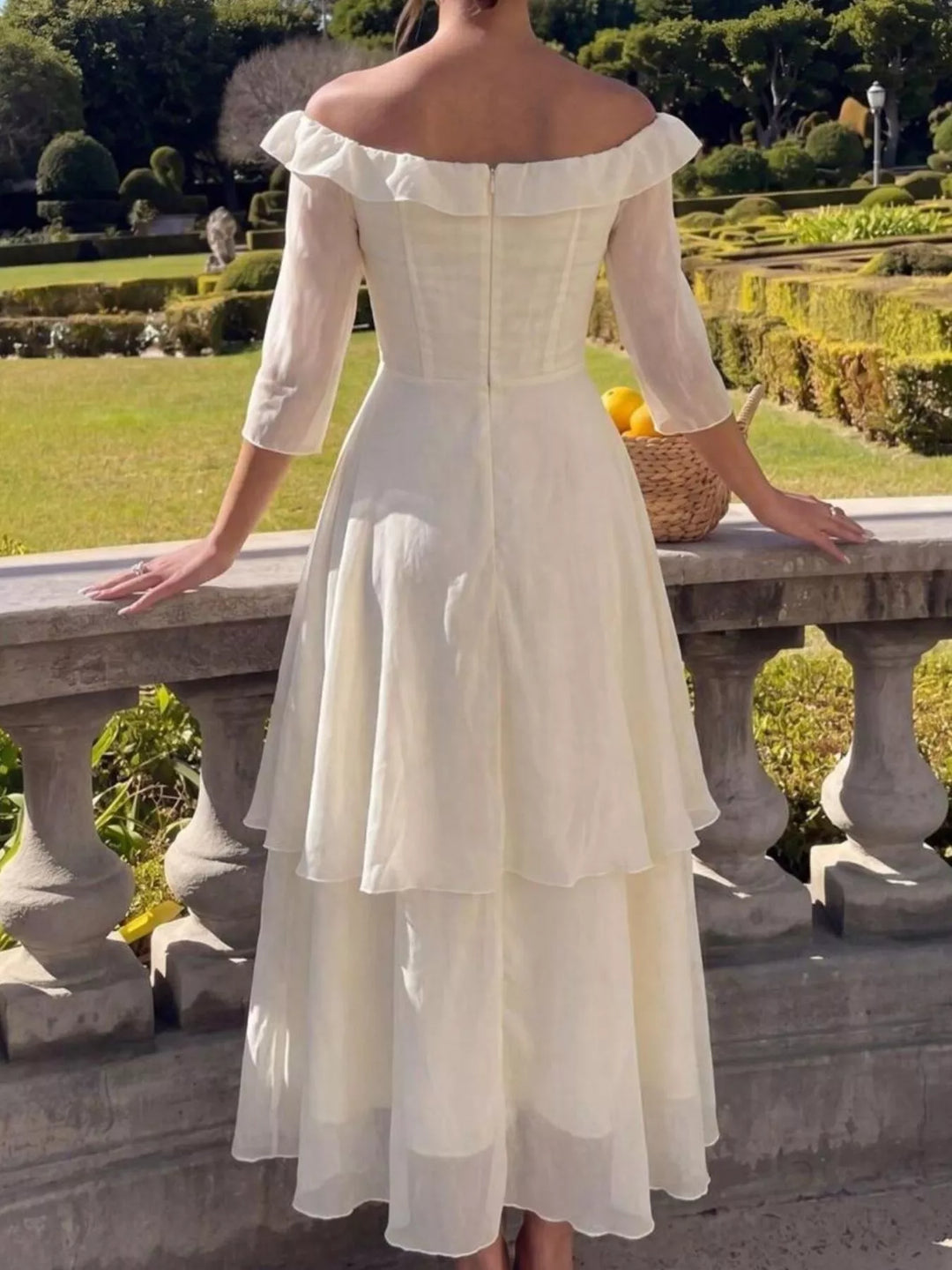 Off-shoulder tiered ruffle midi dress with three-quarter sleeves