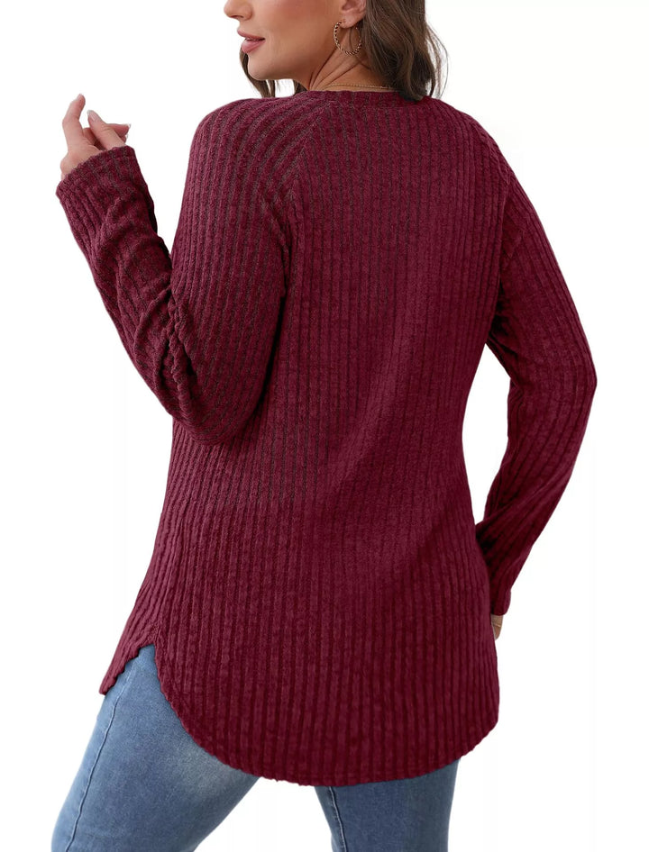 Ribbed knit crew neck long sleeve top with curved hem