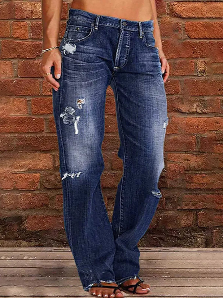 Distressed loose fit straight leg jeans with raw hem
