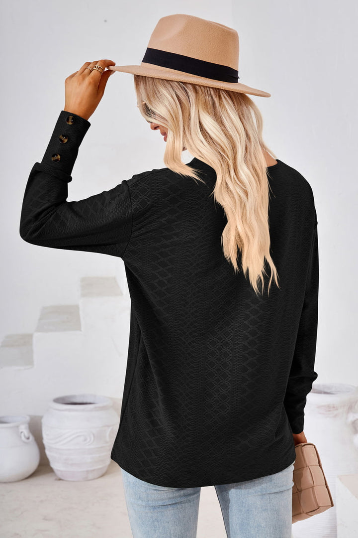 Textured knit V-neck long sleeve top with button cuffs