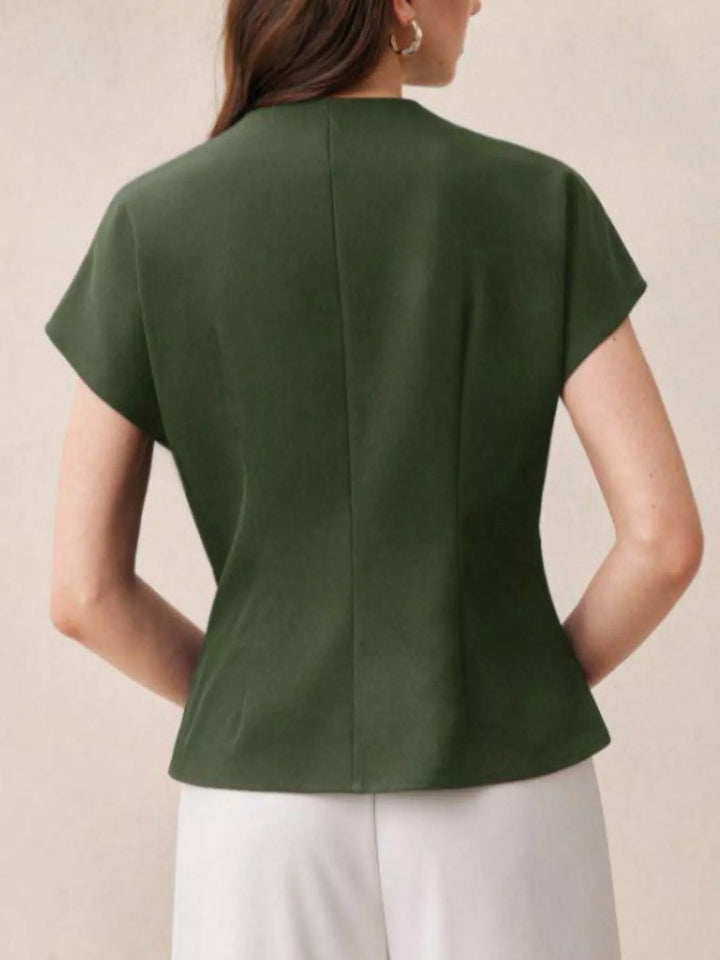 Wrap-front cap sleeve blouse with single wooden button