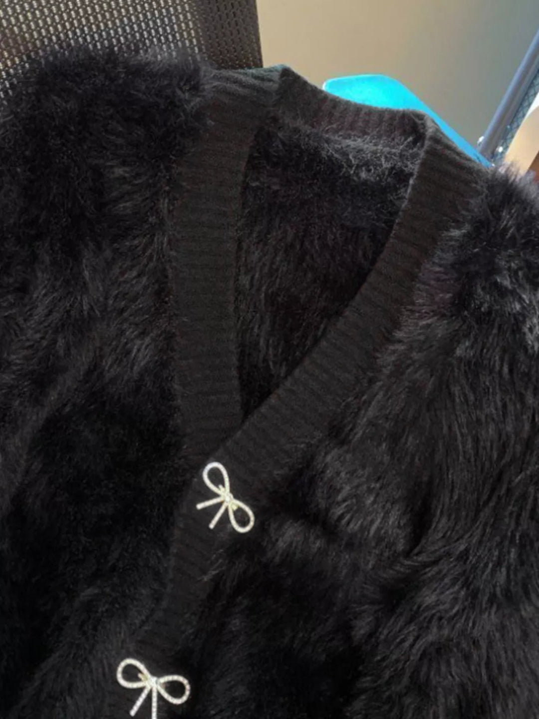 Fuzzy knit cropped cardigan with rhinestone bow buttons