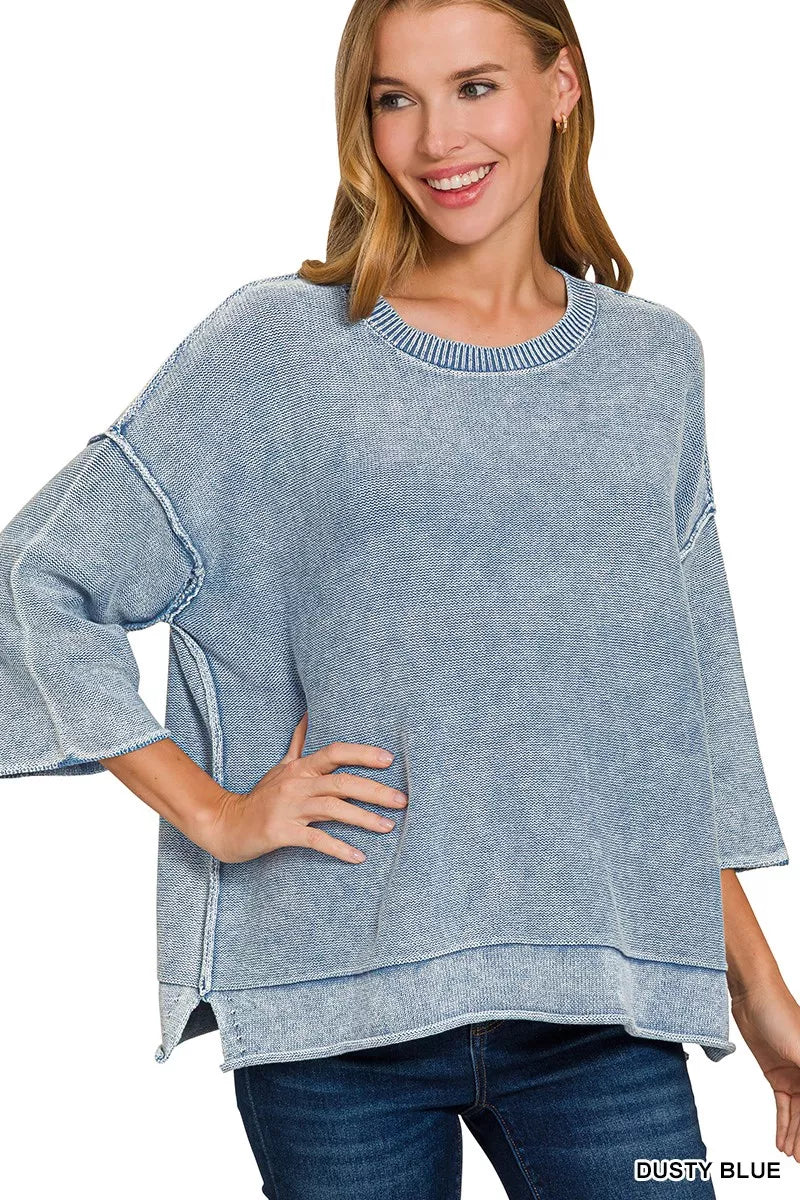Washed boxy sweater with exposed seams and 3/4 sleeves