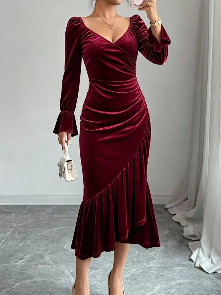 Ruched velvet midi dress with ruffle hem and flared cuffs