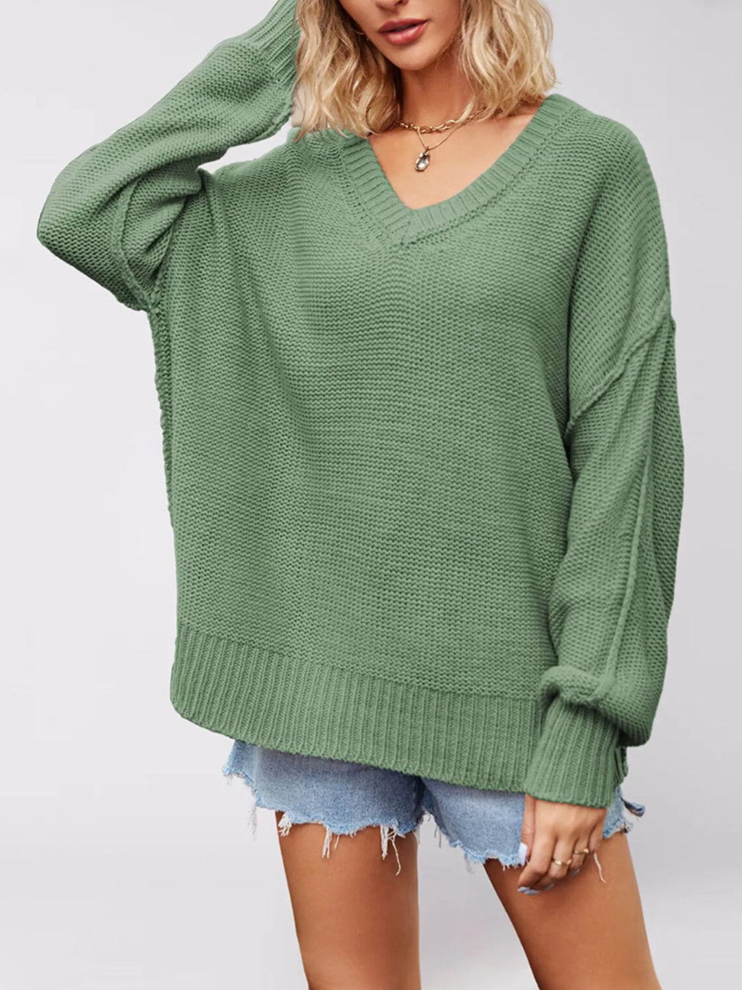 Drop shoulder V-neck sweater with exposed seams