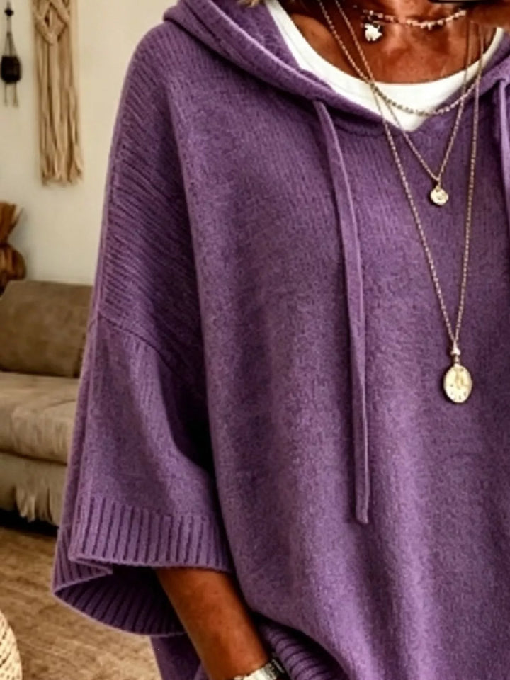 Oversized hooded sweater with drawstring and ribbed trim