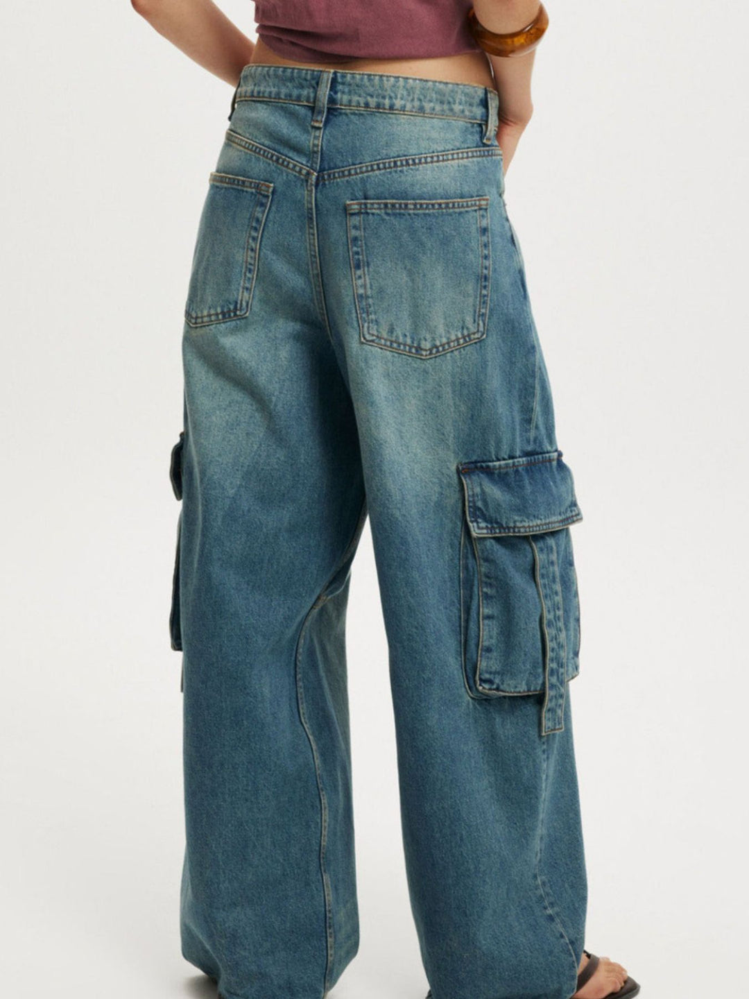 Vintage wash wide-leg cargo jeans with strap pockets