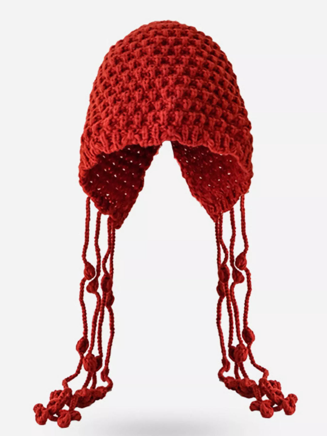 Chunky knit earflap beanie with braided tassel ties