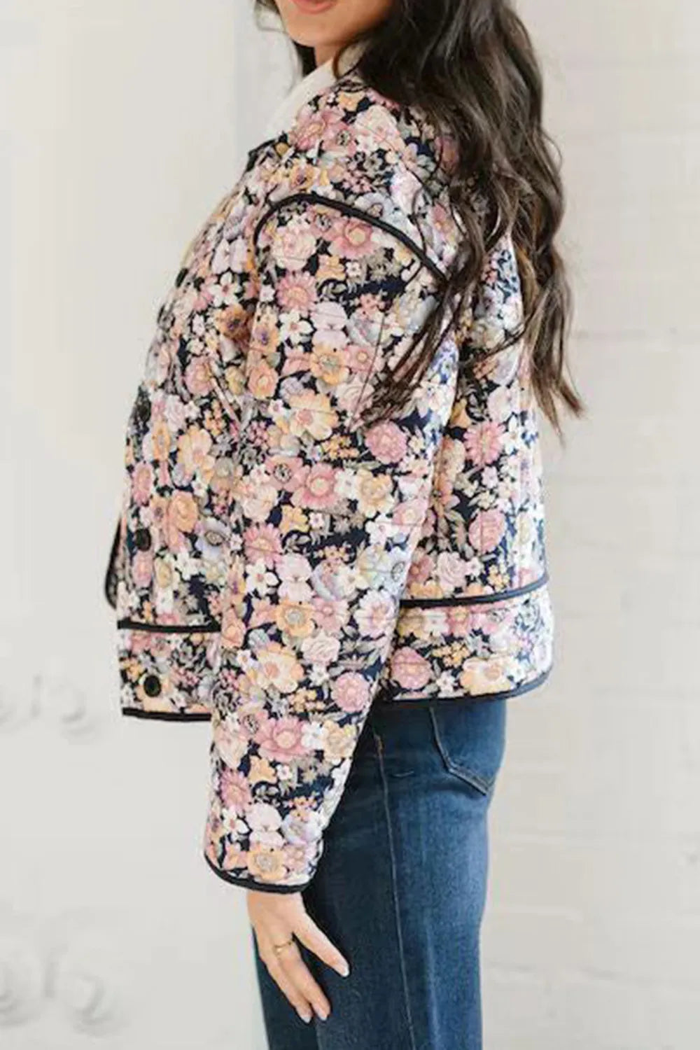 Black Quilted floral jacket with contrast piped trim and round neck