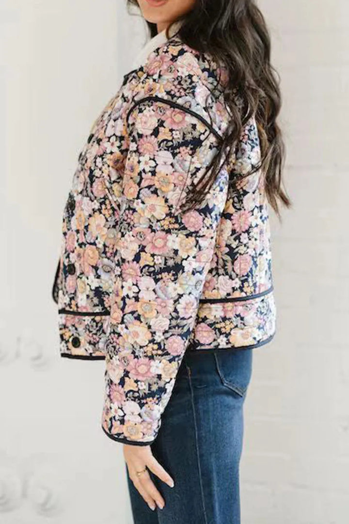 Black Quilted floral jacket with contrast piped trim and round neck
