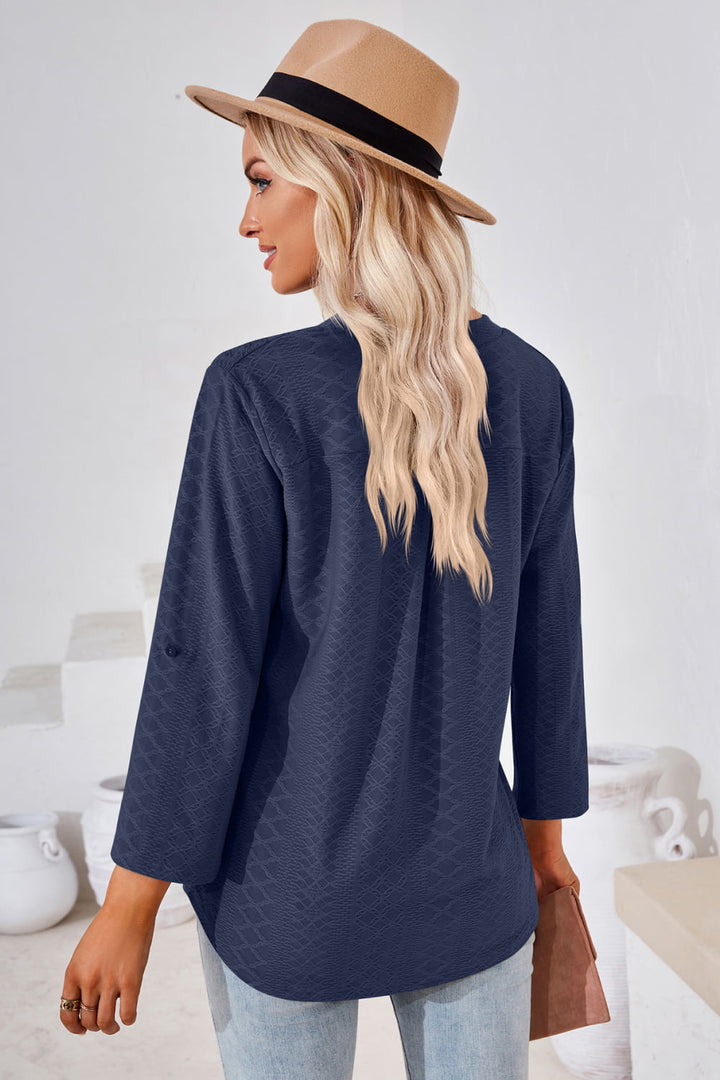 Textured split v-neck blouse with roll-tab sleeves
