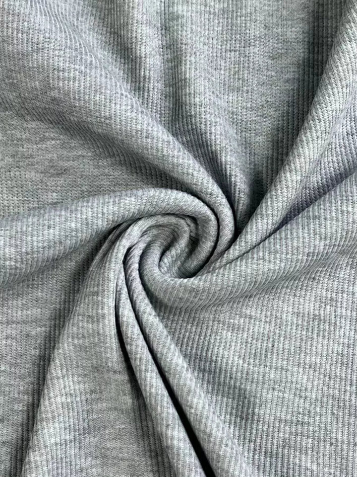 Ribbed knit top with ruffled cap sleeves