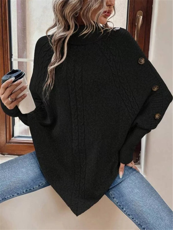 Cable knit turtleneck cape sweater with button shoulder