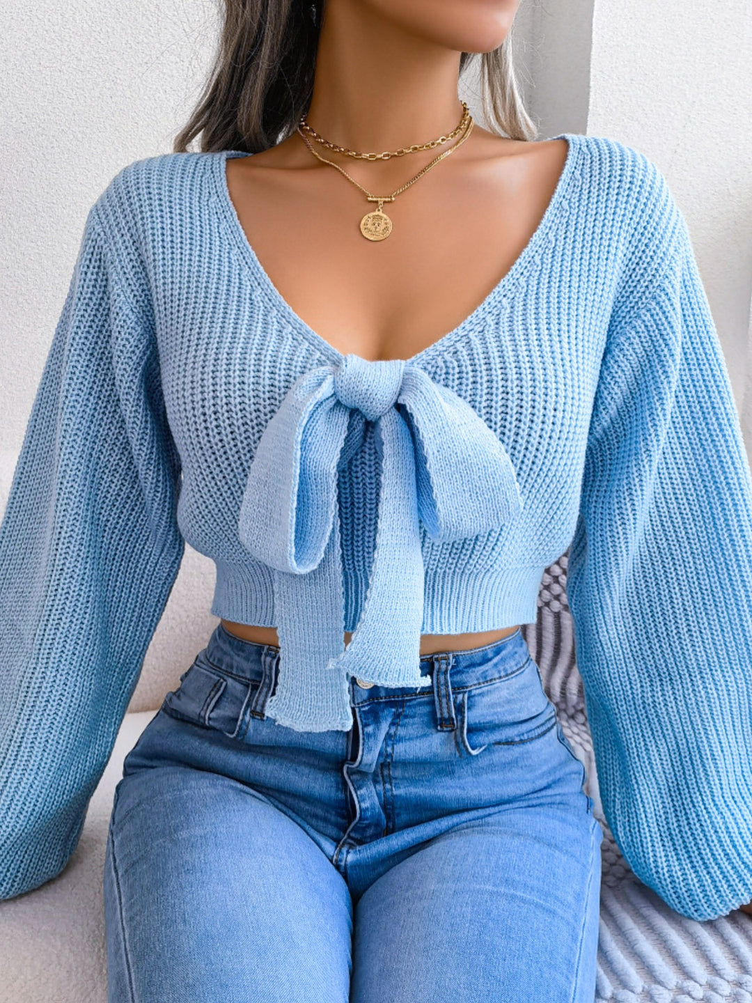 Tie-front ribbed knit cropped sweater with deep V-neck