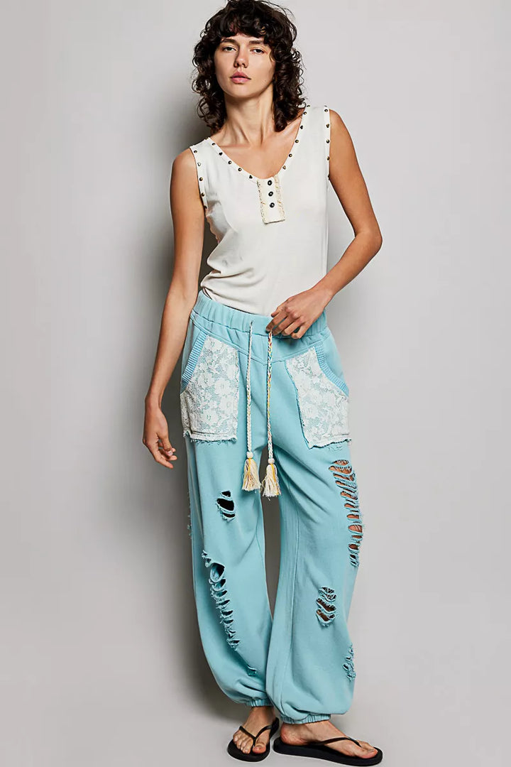 Studded V-neck sleeveless knit tank with button-front ruffle