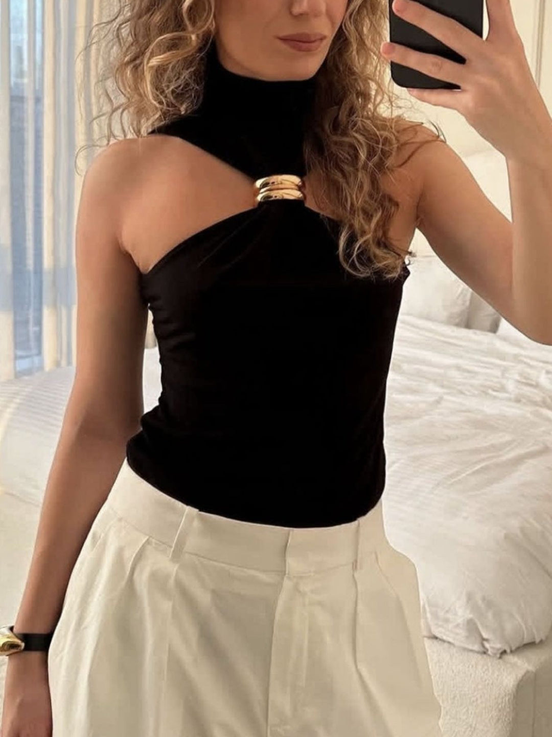 Sleeveless turtleneck tank with gold ring cutout detail