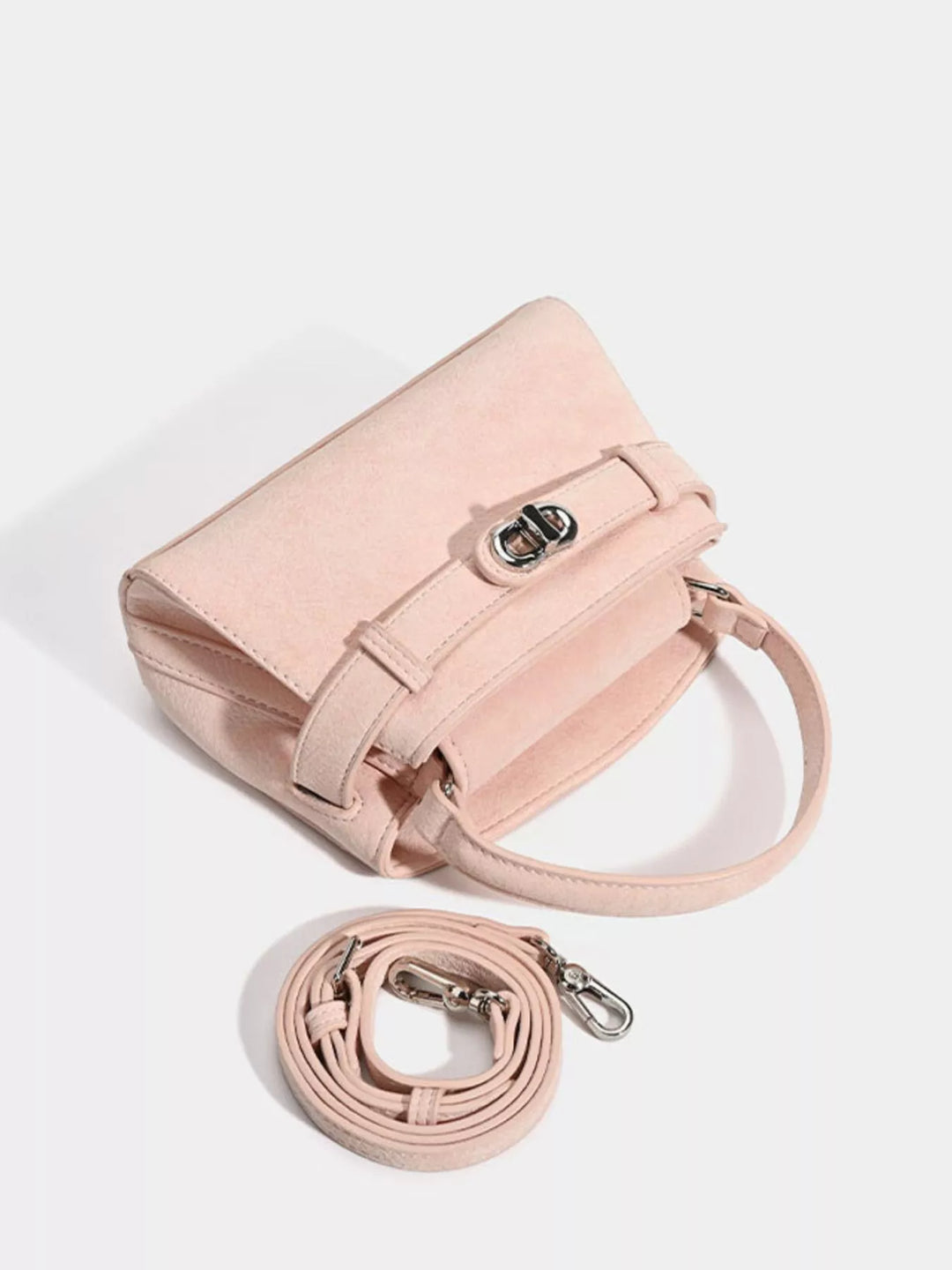 Mini belted crossbody bag with top handle and twist lock