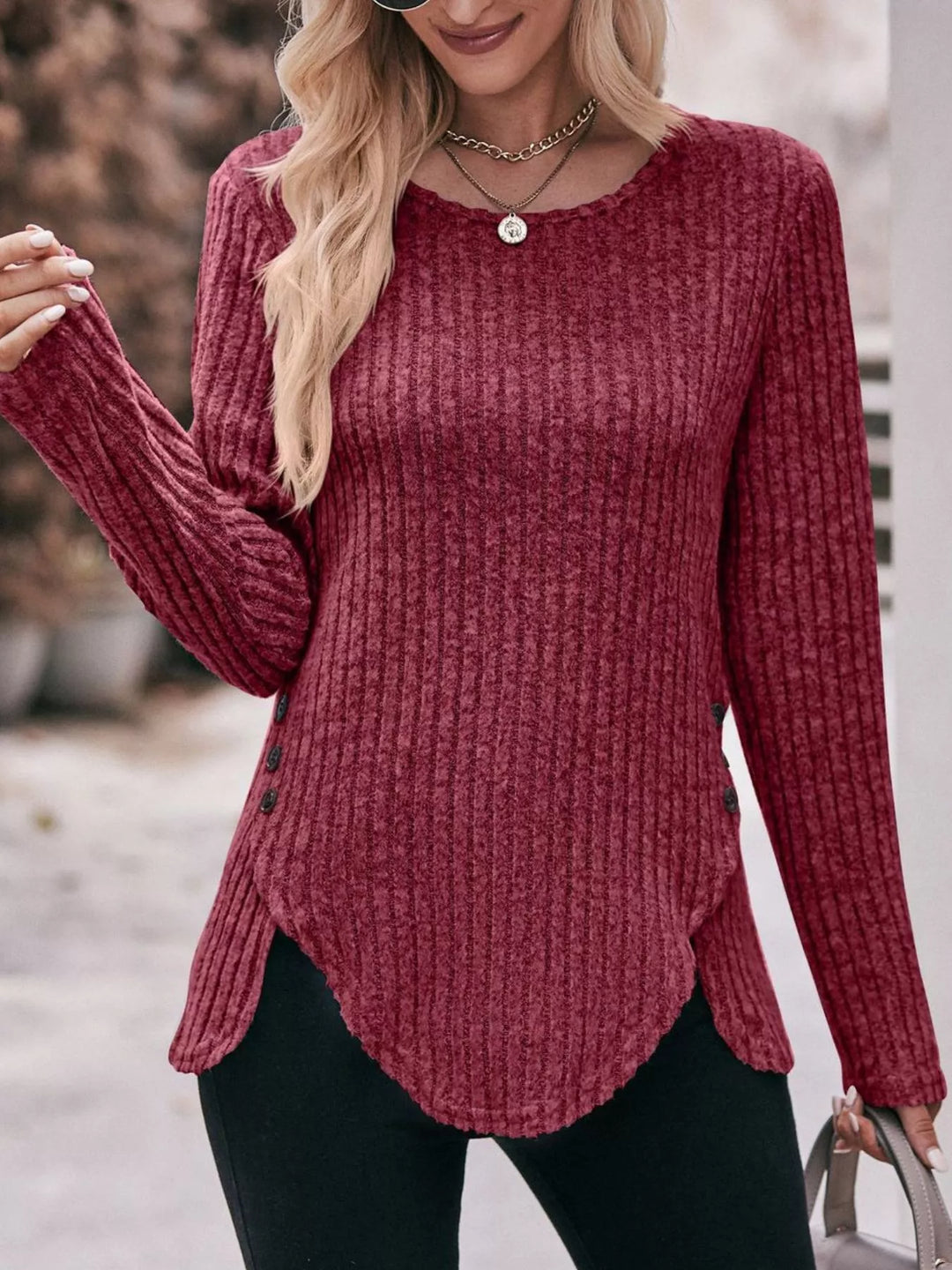 Ribbed knit long sleeve top with side button hem