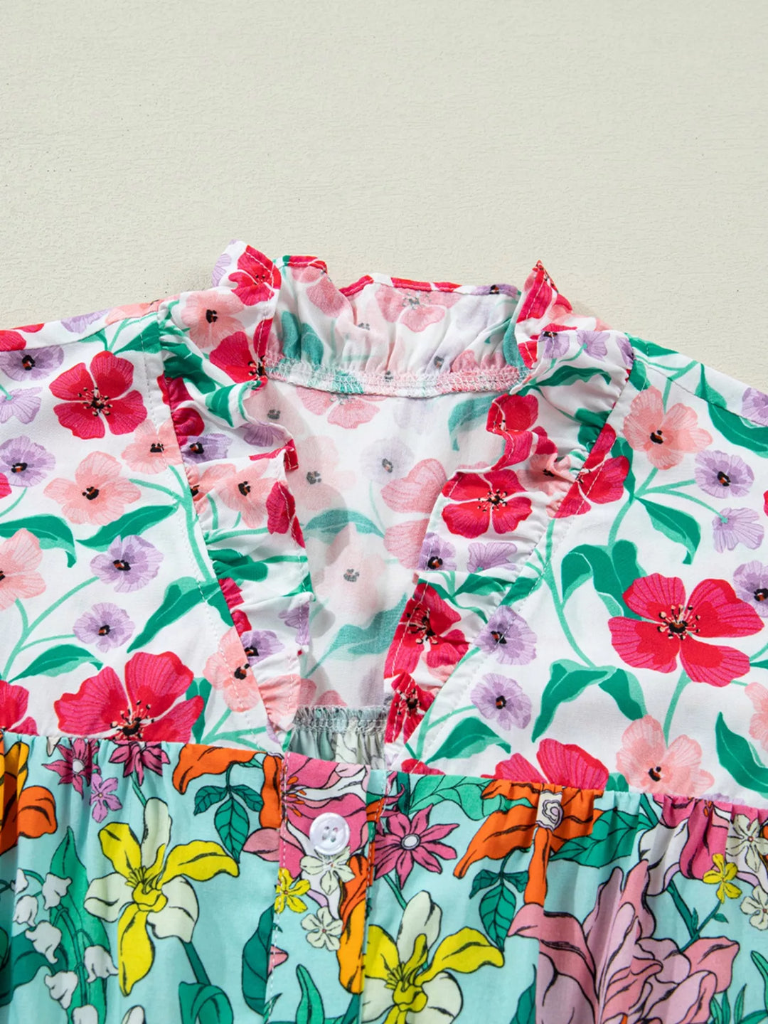 Floral flutter sleeve split-neck button-front blouse