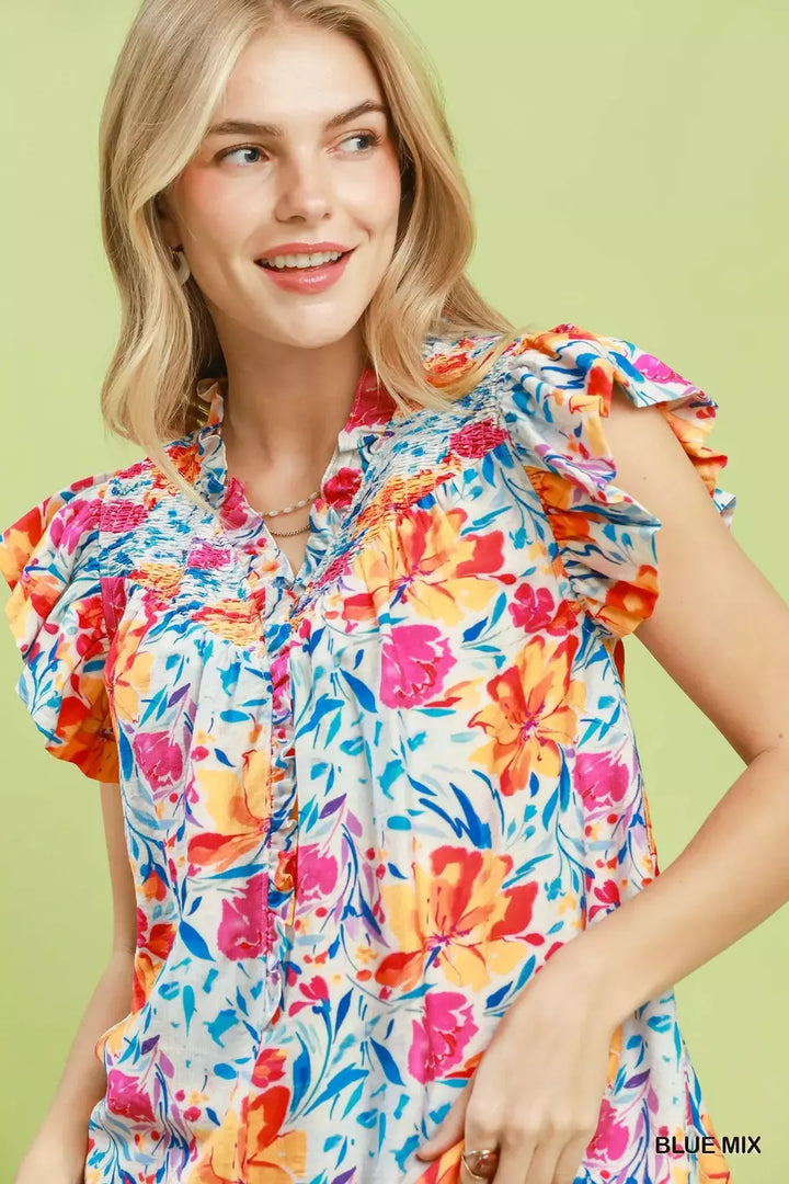 Smocked yoke floral blouse with flutter ruffle sleeves