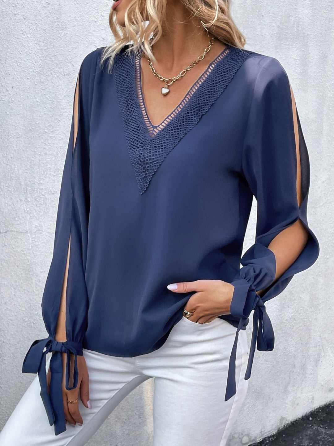 Crochet-trim V-neck blouse with slit tie-cuff sleeves